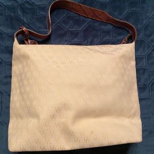 Dooney and Bourke monogram canvas ivory purse.